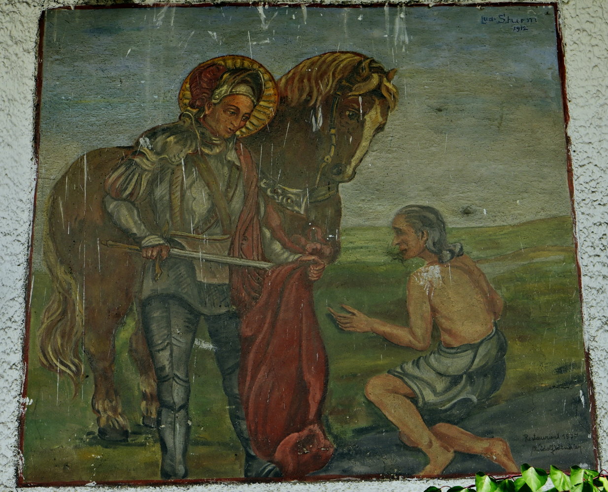 Der heilige Martin an der Fassade eines Bauernhofs.